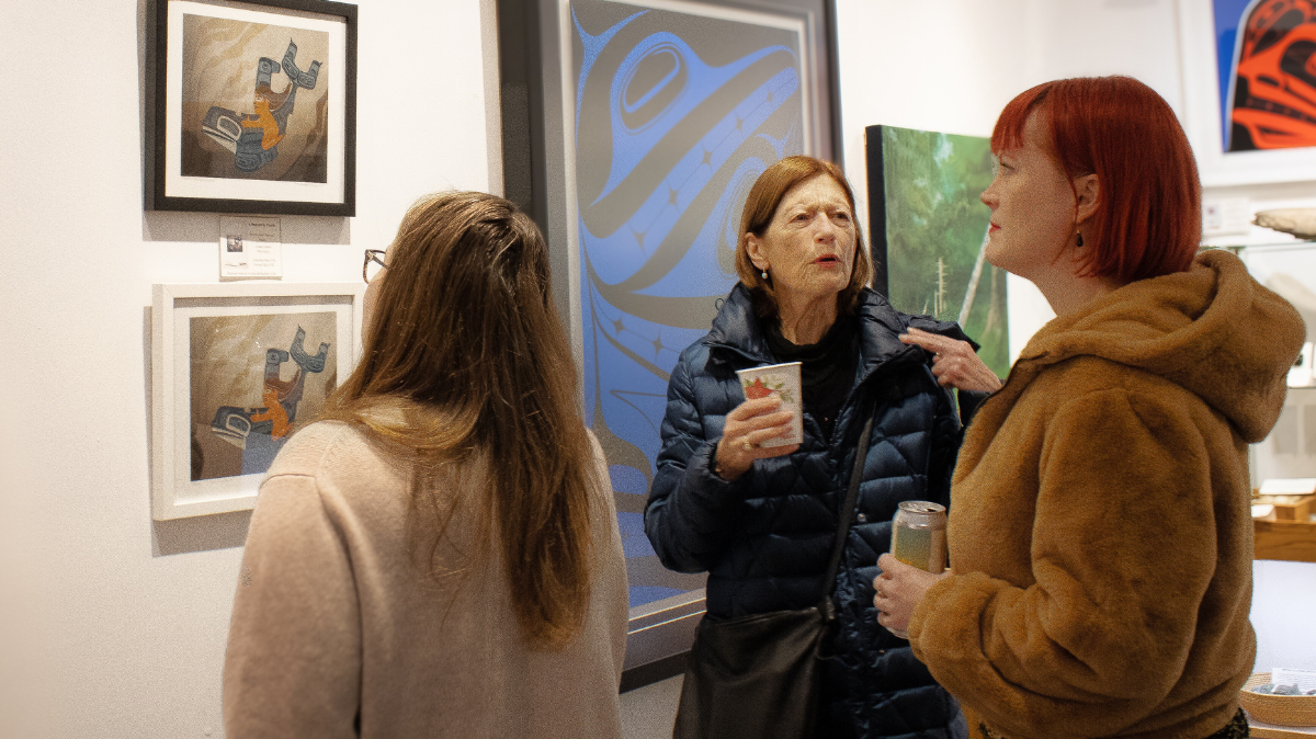 women looking at artwork