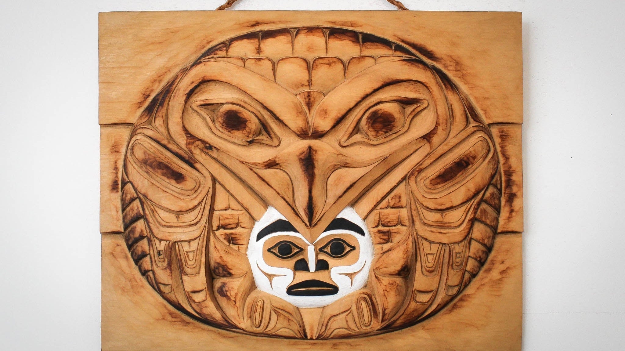 Raven Steals the light hand carved wood panel by local Haida Gwaii artist Billy Yovanovich