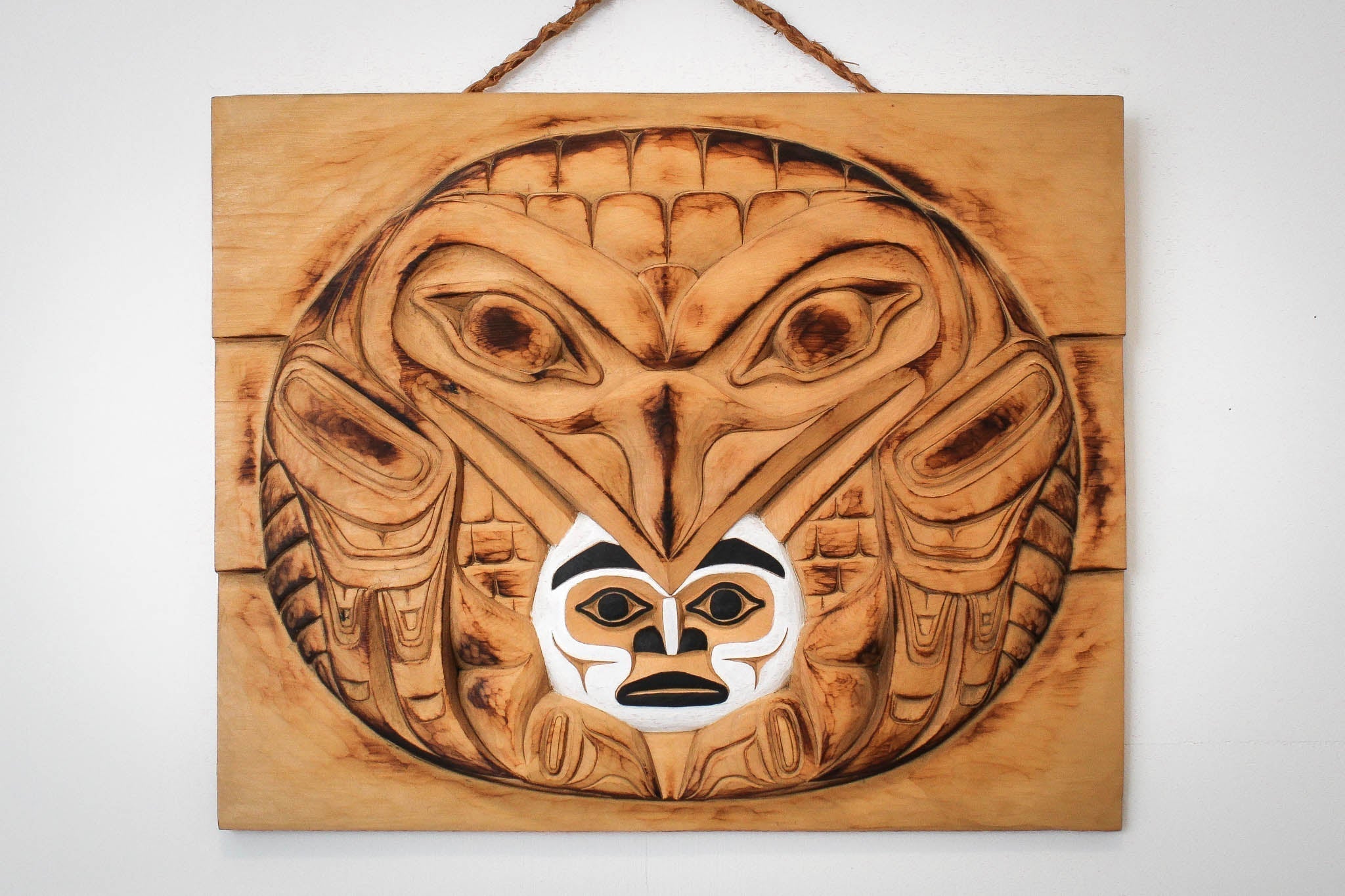 Raven Steals the light hand carved wood panel by local Haida Gwaii artist Billy Yovanovich