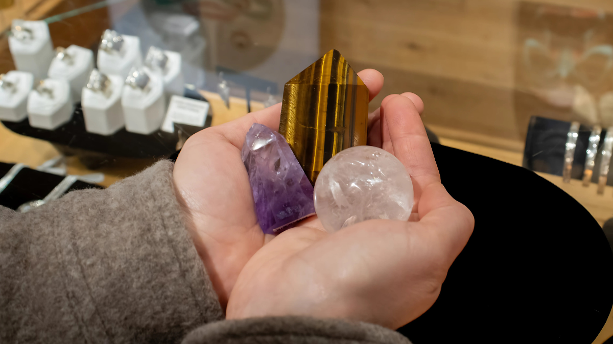Hands holding crystals