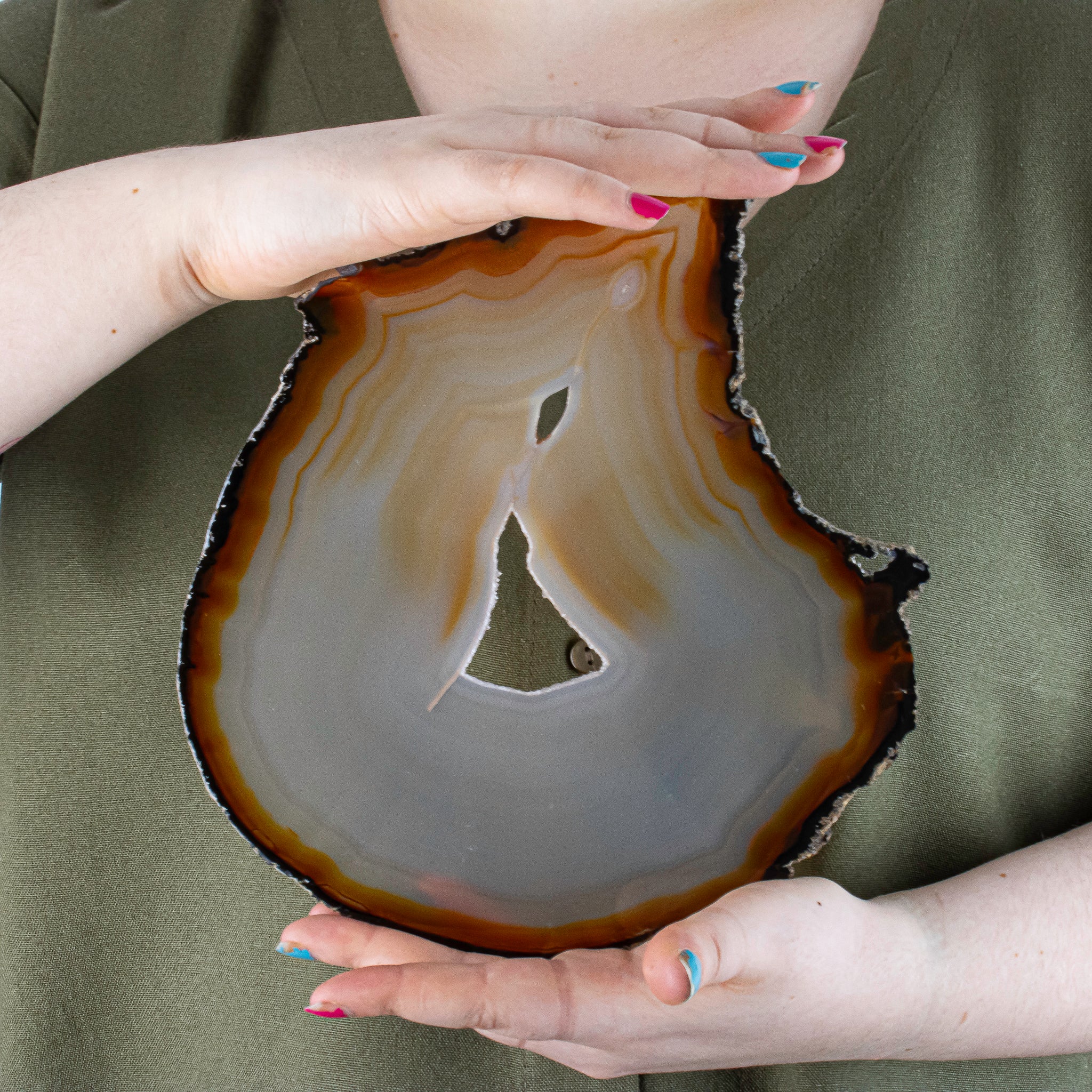 Carnelian Agate Slice with Druzy Quartz, Held by model for size ratio