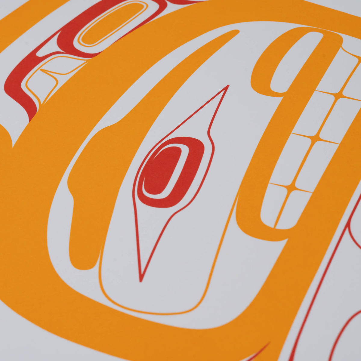 A close-up of a serigraph print featuring bold orange and red abstract curved shapes on white paper.