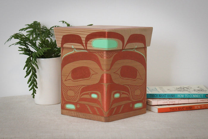 Eagle design painted onto a wooden box placed on a table