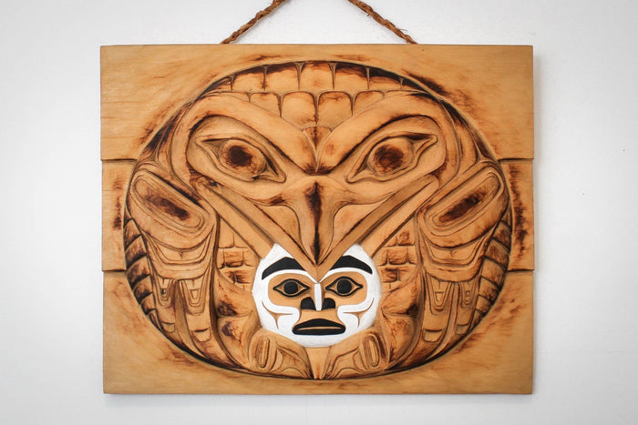 Raven Steals the light hand carved wood panel by local Haida Gwaii artist Billy Yovanovich
