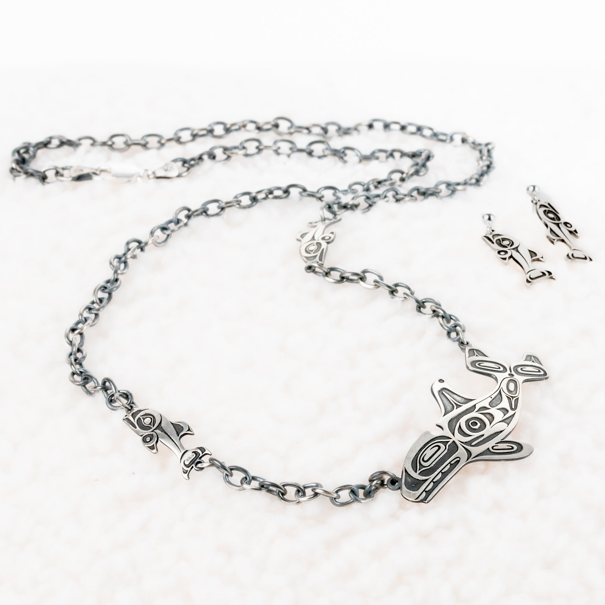 Sterling Silver Salmon earrings with matching Killer. whale and Salmon necklace by Native artist Morgan Asoyuf