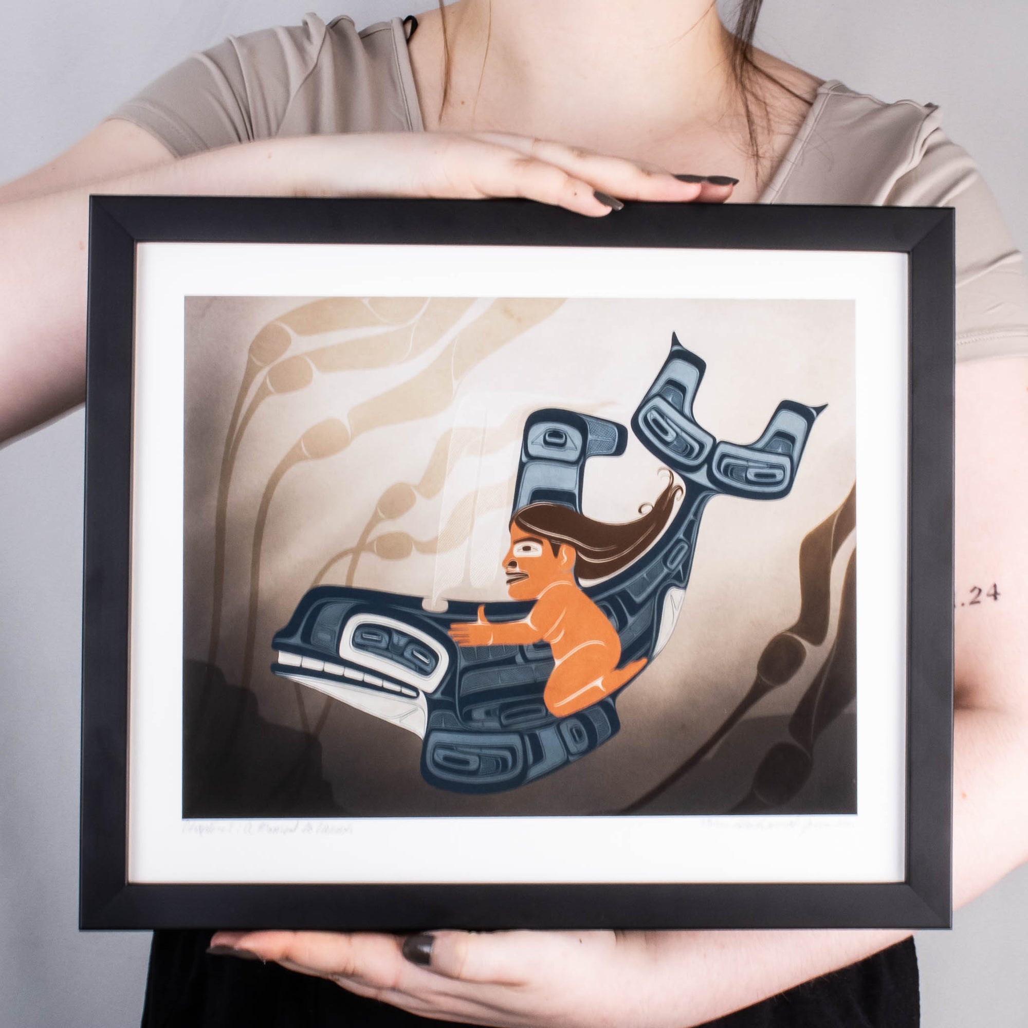 Model holding art print, A Moment to Vanish by Shoshannah Greene with Black Frame