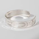 Hand carved sterling silver Eagle bracelet by Haida artist Alvin Adkins side view