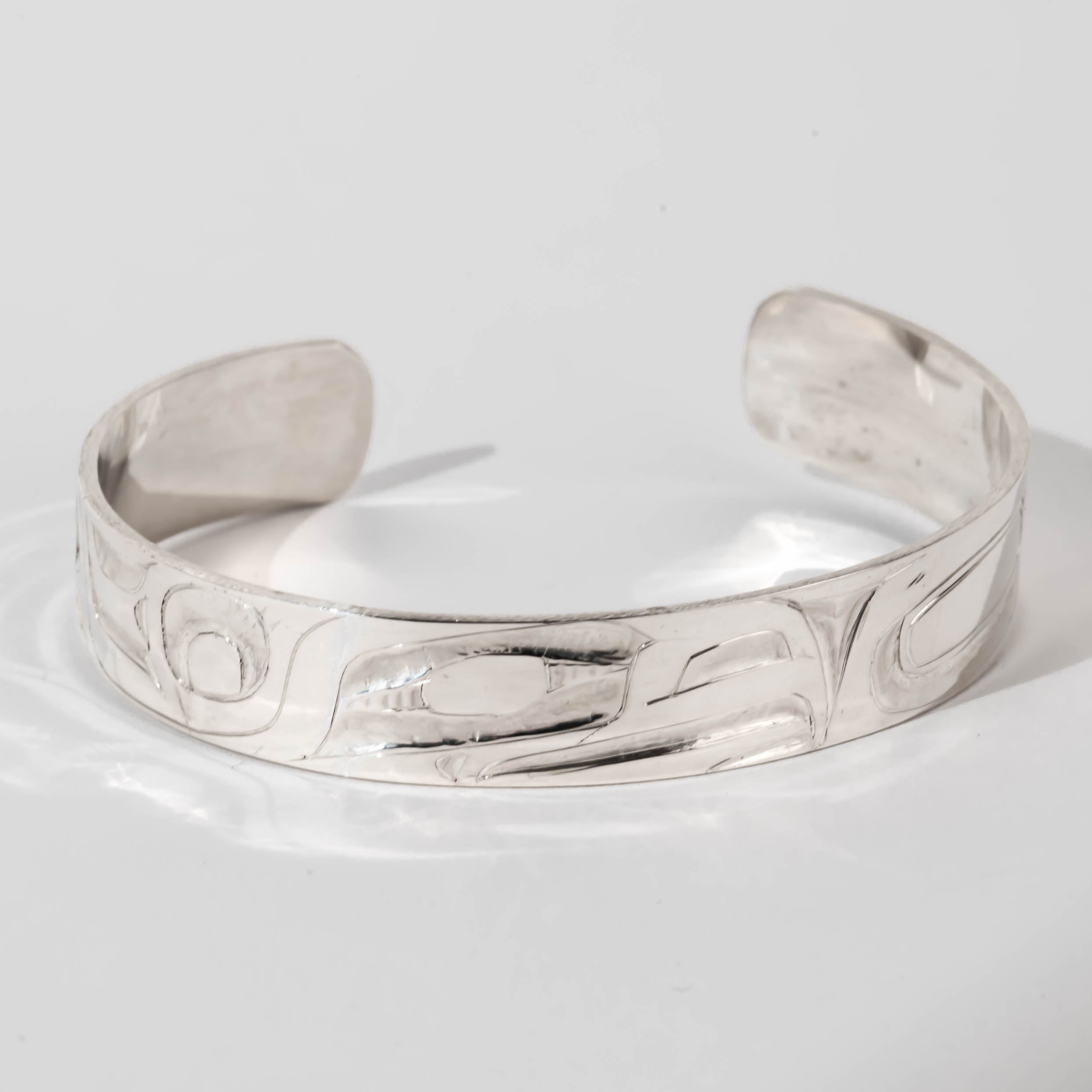 Hand carved sterling silver Eagle bracelet by Haida artist Alvin Adkins front view