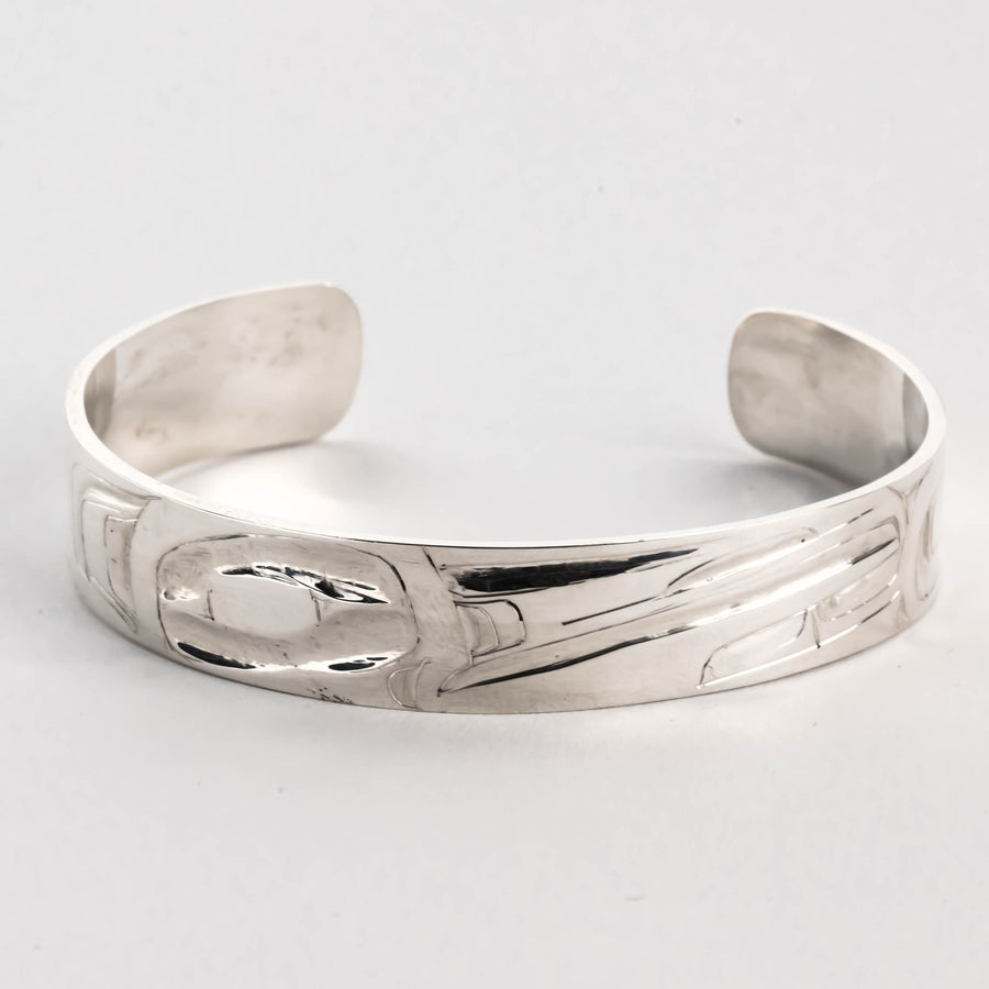 Hand carved sterling silver hummingbird bracelet by Haida artist Alvin Adkins front view