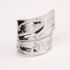 Silver ring with a unique design on a white background