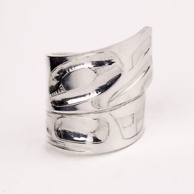 Silver ring with a unique design on a white background