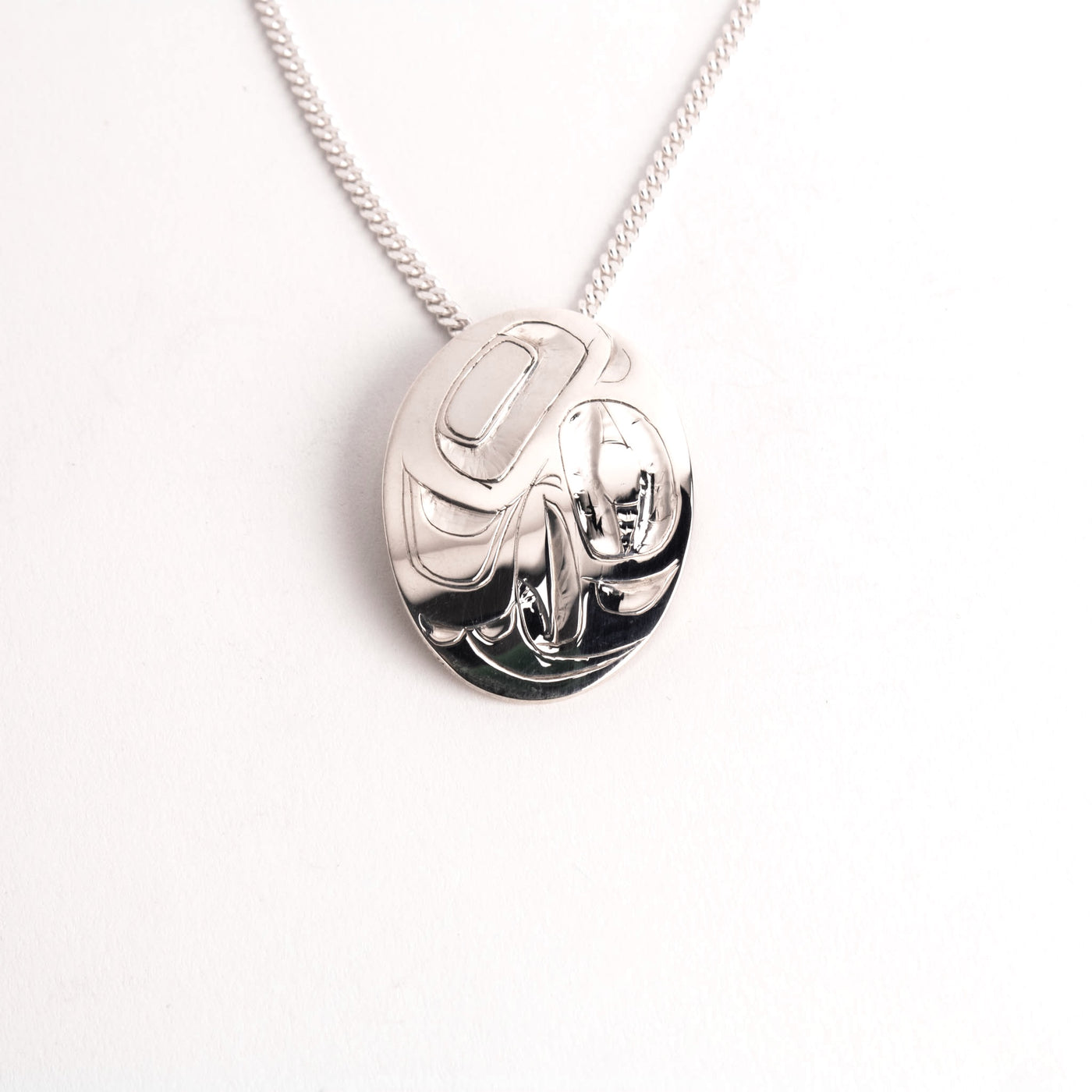 Sterling Silver Oval Eagle Pendant by Alvin Adkins (Haida)