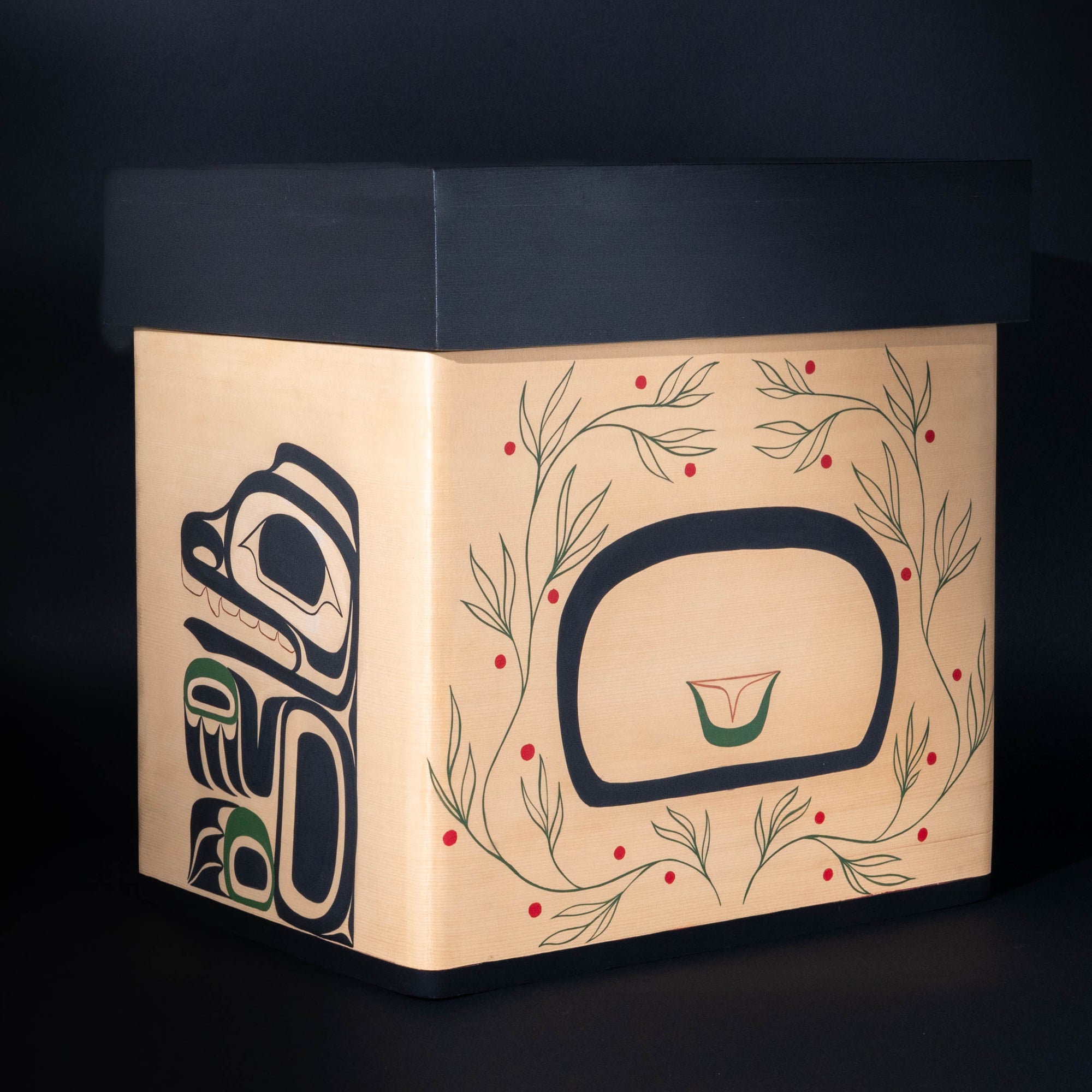 Hand painted original Bear Mother Bentwood box by Haida artist Daisy White showcasing. the back of the box and side where bear cub and the back of bear mother is painted incased in huckle berries