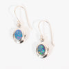 Pair of silver earrings with opal stones on a white background