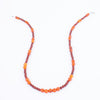 Photo showing of the center beads of a Hand beaded deep red and orange Carnelian Agate Necklace with  sterling silver clasp