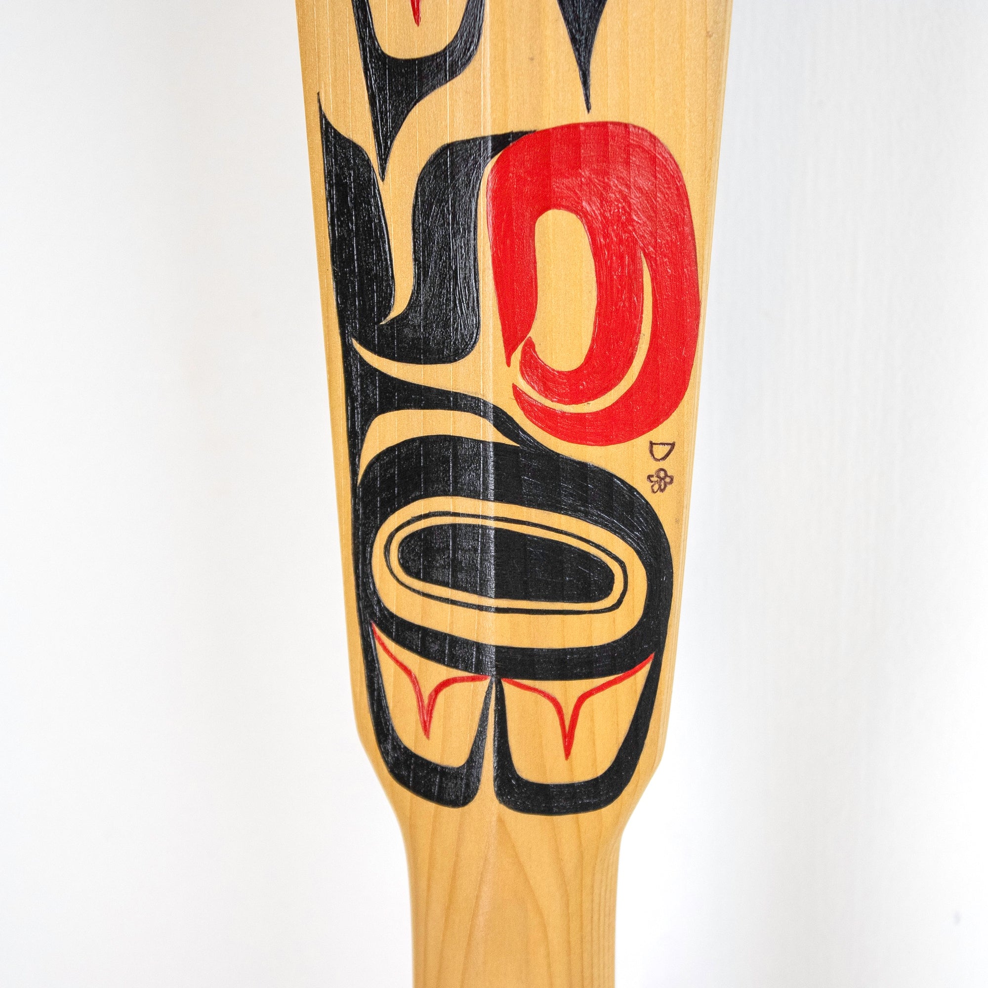 Close-up of painted wood paddle