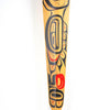 Close-up of painted wood paddle with northwest coast formline design