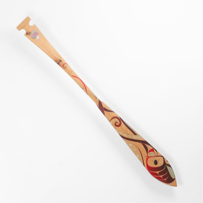 Decorative wooden Haida paddle with artistic Formline octopus design designs on a white background
