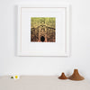 Haida Gwaii fine art print featuring a totem pole in front of a long house, the entrance of the longhouse is at the ottom of the pole with a bear around it, then a beaver and a watchmen