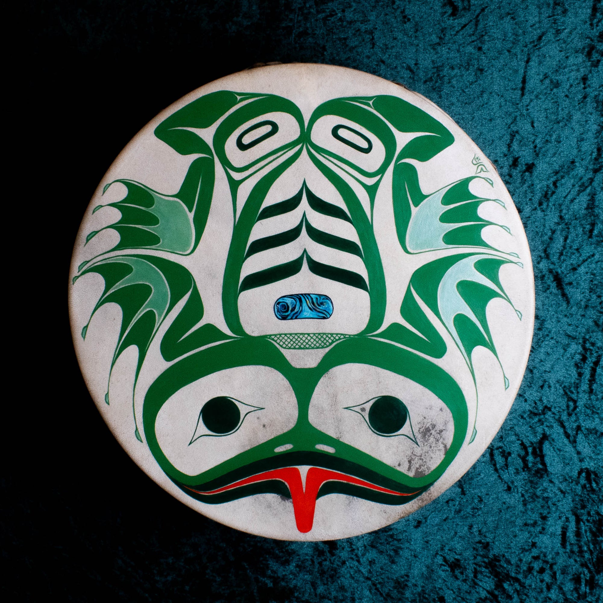 Frog drum in formline design with green background