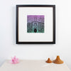 Haida Gwaii fine art print featuring a totem pole in front of a long house, the entrance of the longhouse is at the bottom of the pole with a bear around it, then a beaver and a watchmen. In a modern interrior design set up