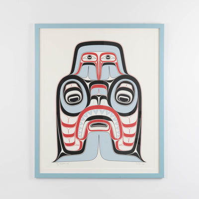 Haida Art print featuring supernatural being Dogfish mother. with bold red and black, and soft blue hues to show contrast, framed in a driftwood was frame
