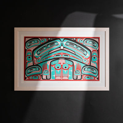 Colorful abstract formline chiefs chair design with geometric haida patterns  framed on a dark background