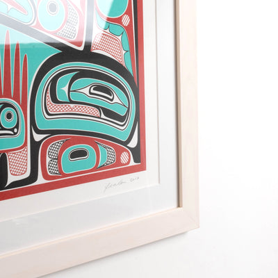 Colorful abstract formline chiefs chair design with geometric haida patterns  framed showing corner on a white background