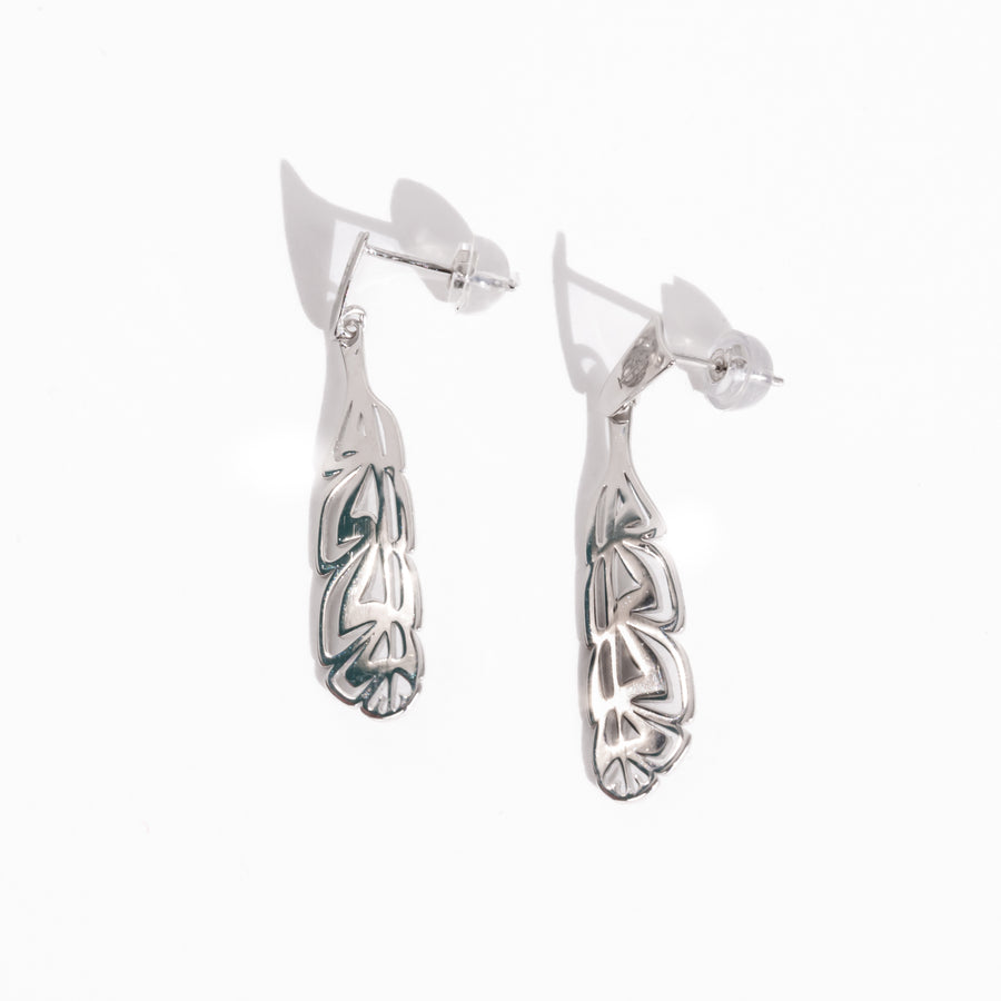 Sterling Silver Manifesto eagle earrings by Haida Artist Gina Mae Schubert on a white back ground