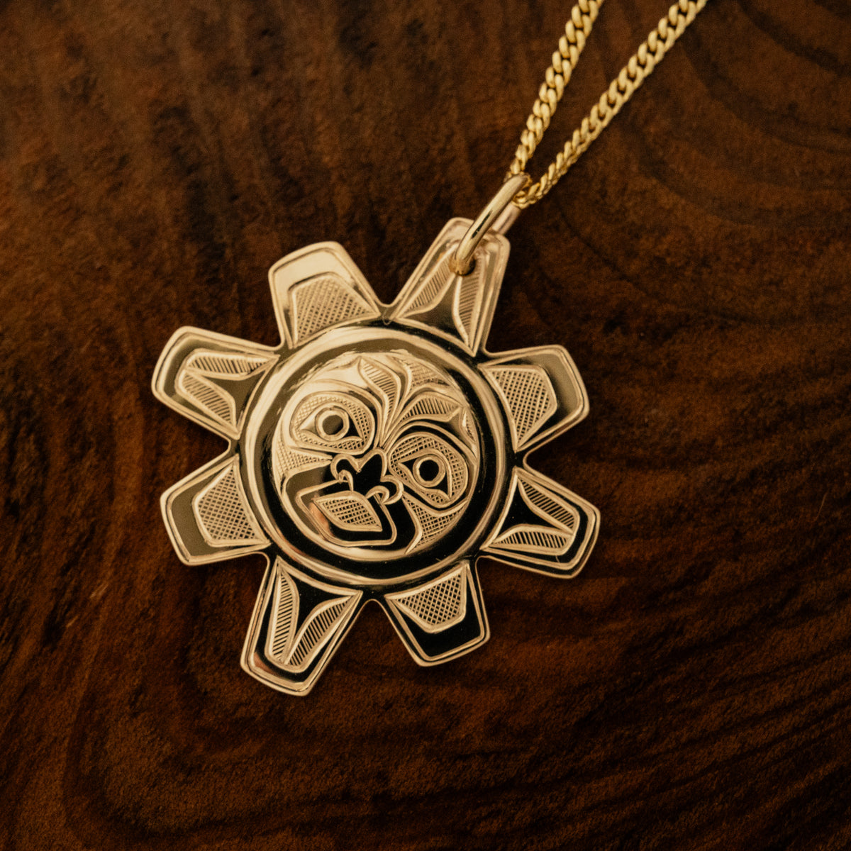Gold Sun Pendant by Gitxsan artist, Meghan McRae