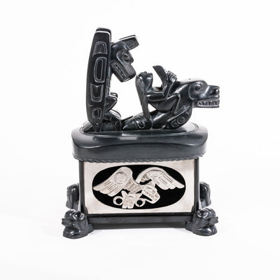 Haida argillite killer whale and thunderbird argillite and sterling silver box done by master Haida artist Ding Hutchingson on a white background showing the left side