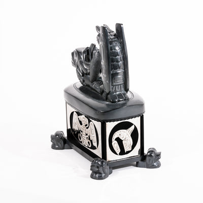 Haida argillite killer whale and thunderbird argillite and sterling silver box done by master Haida artist Ding Hutchingson on a white background showing the back and right side