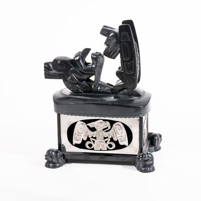Haida argillite killer whale and thunderbird argillite and sterling silver box done by master Haida artist Ding Hutchingson on a white background showing the right side
