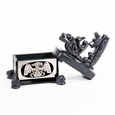 Haida argillite killer whale and thunderbird argillite and sterling silver box done by master Haida artist Ding Hutchingson on a white background showing the open lid