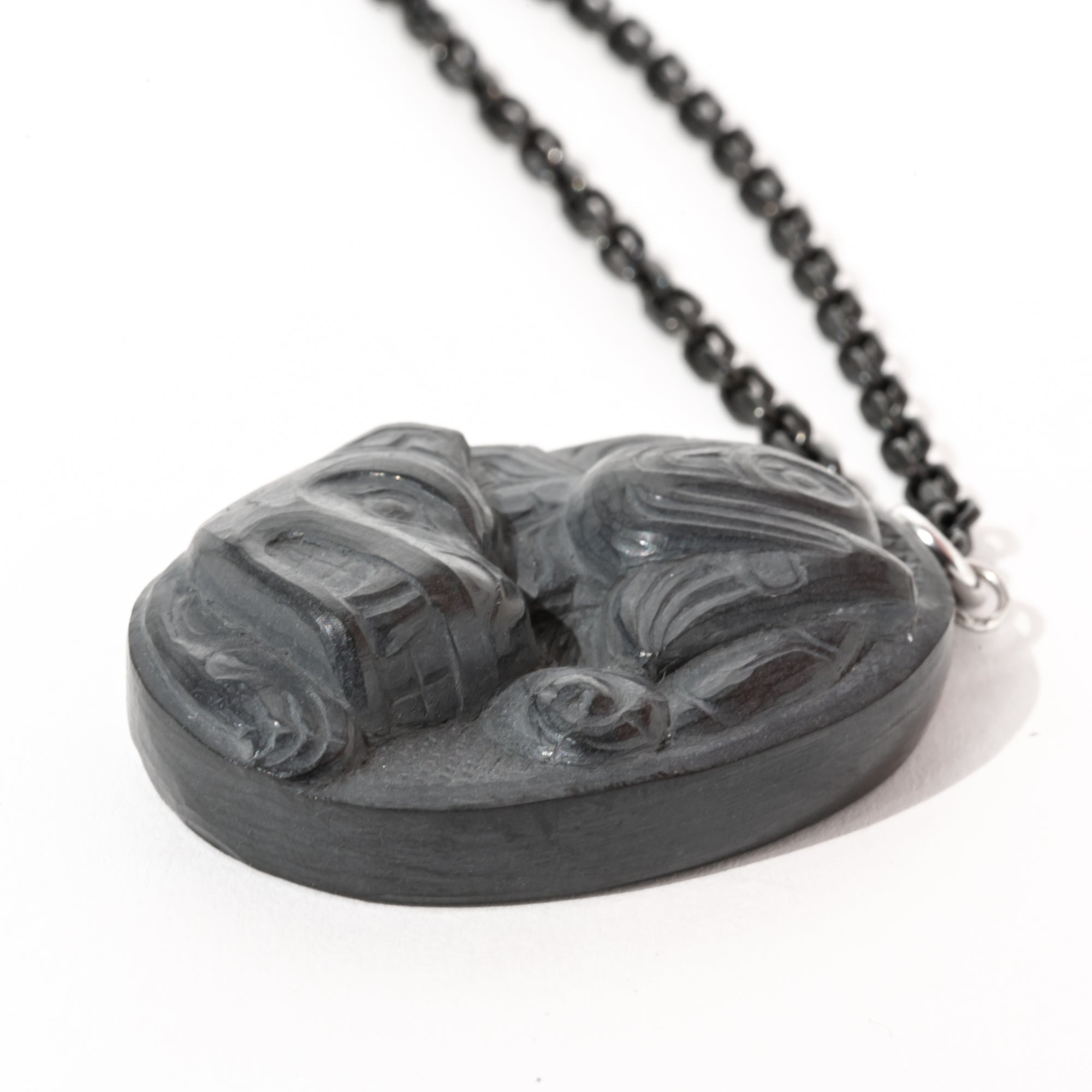 Photo showcasing the depth of carving of the Haida Gwaii Argillite Sea Grizzly Pendant hand carved by Haida Artist Melanie Russ