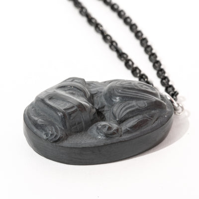 Photo showcasing the depth of carving of the Haida Gwaii Argillite Sea Grizzly Pendant hand carved by Haida Artist Melanie Russ