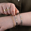 Sterling silver and gold nature inspired wolf Hummingbird Bracelet worn with a verity of northwest coast indigenous bracelets rings, and Italian gold gucci puff chain
