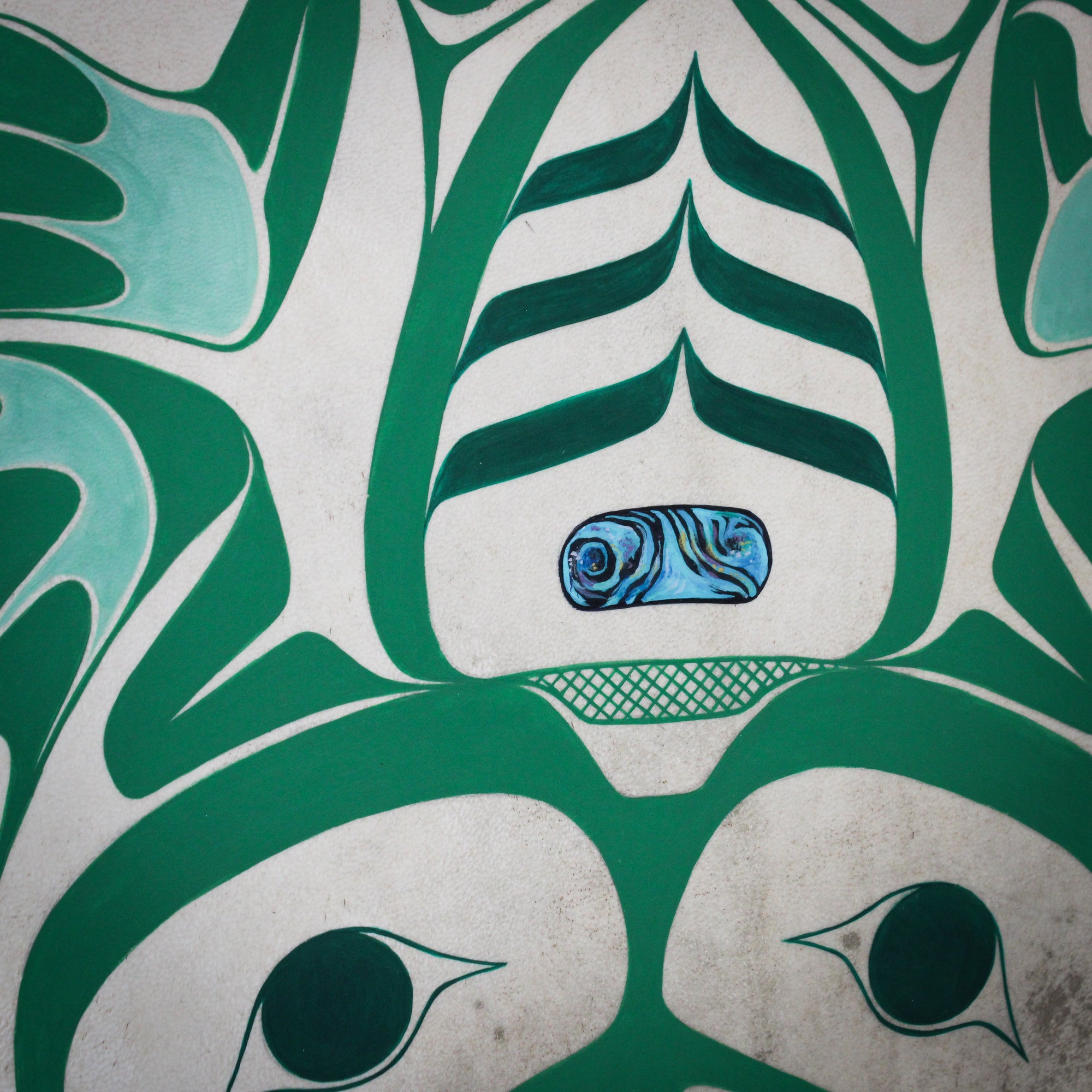 Close up of abalone painting on the frog drum