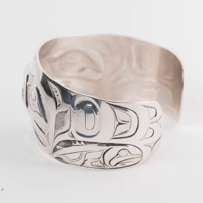 Salmon view Sterling Silver cuff bracelet with intricate Eagle and Salmon Repoussé design
