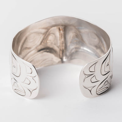 Back view Sterling Silver cuff bracelet with intricate Eagle and Salmon Repoussé desig