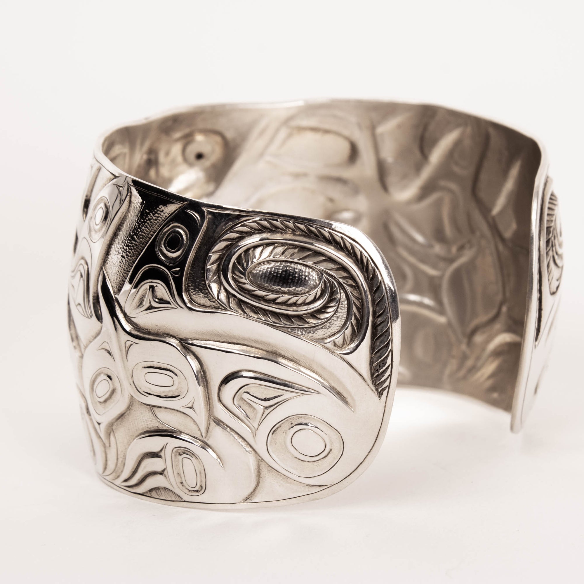 Sterling Silver Wasco and Killer Whale repousse Bracelet by master carver Jesse Brillon (Haida)