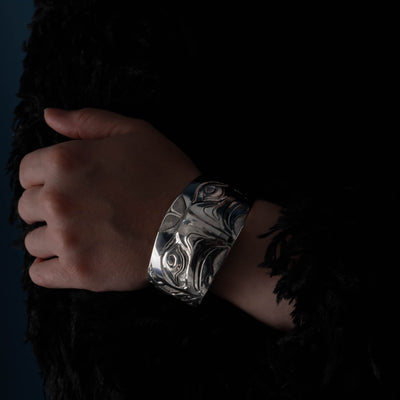 Hand wearing a silver