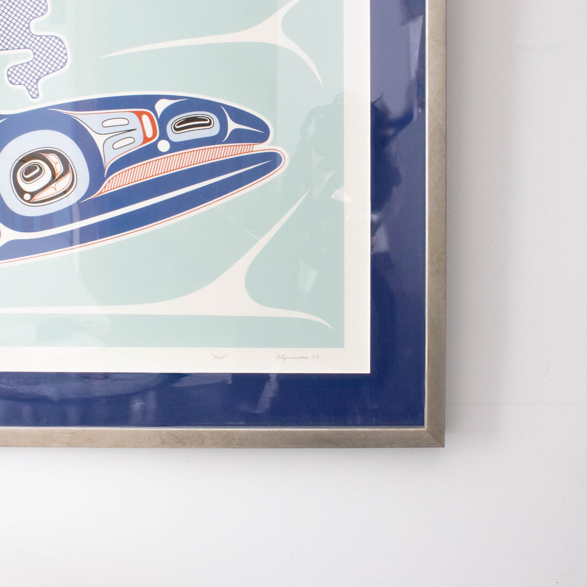 Close-up of the corner of a blue whale framed artwork