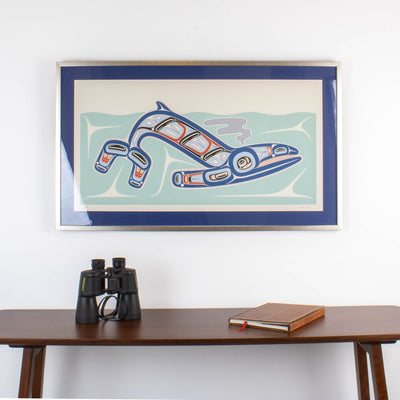 Kun (whale) Fine art print, showcasing a whale swimming through the ocean in Haida Formline. Set in an Interior design