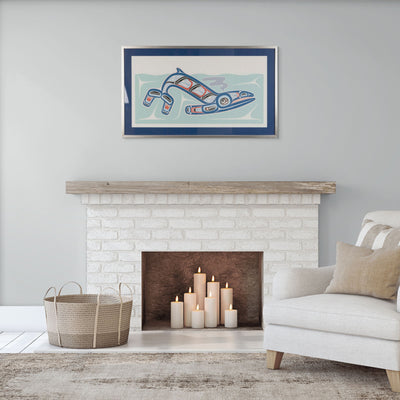 Living room with a white brick fireplace, candles, a basket, and a framed artwork above of Kun (whale) Fine art print, showcasing a whale swimming through the ocean in Haida Formline. Set in an Interior design
