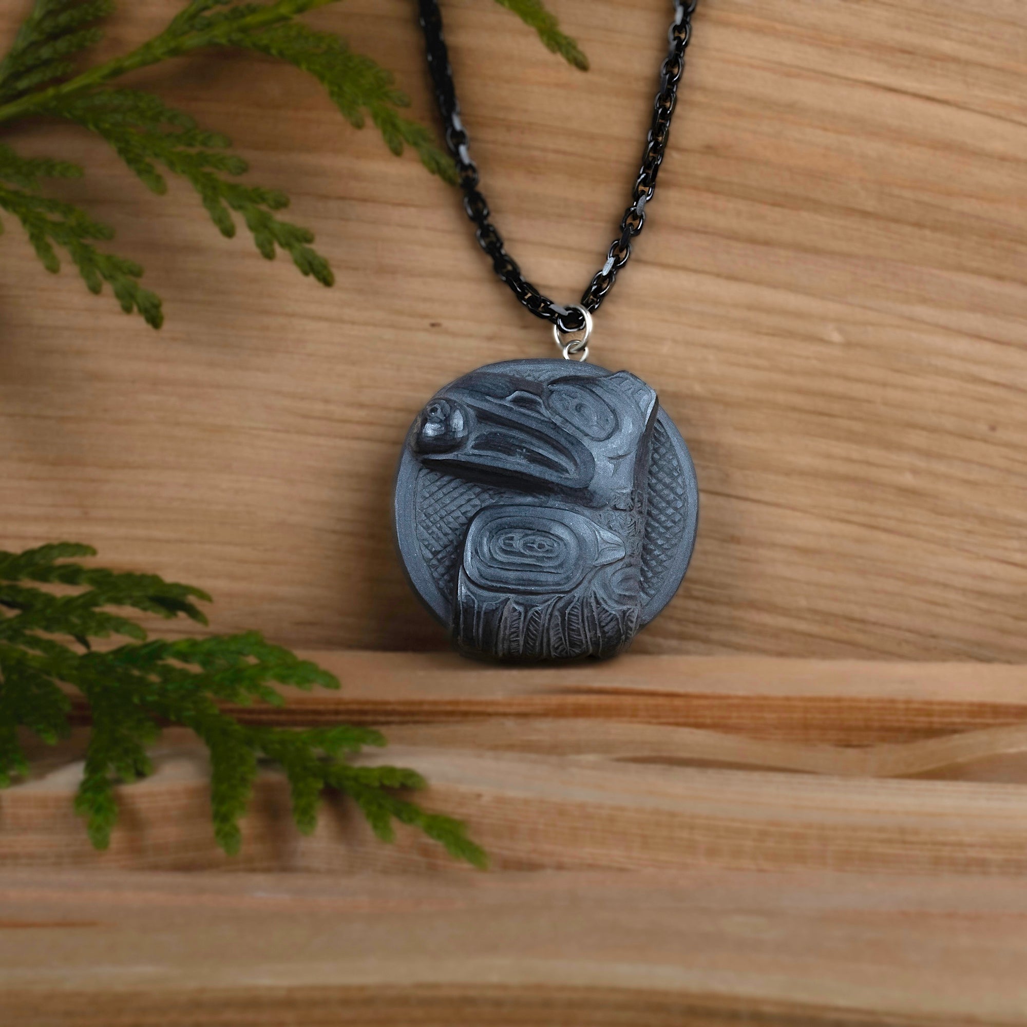 Raven Steals the light pendant in an earth tone cedar setting