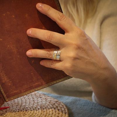 Model wearing Hand carved 14k gold and silver eagle wrap ring carved by Indigenous Canadian Artist Agnes Seaweed Wisden