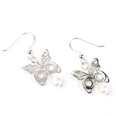 Butterfly-shaped earrings on a white background
