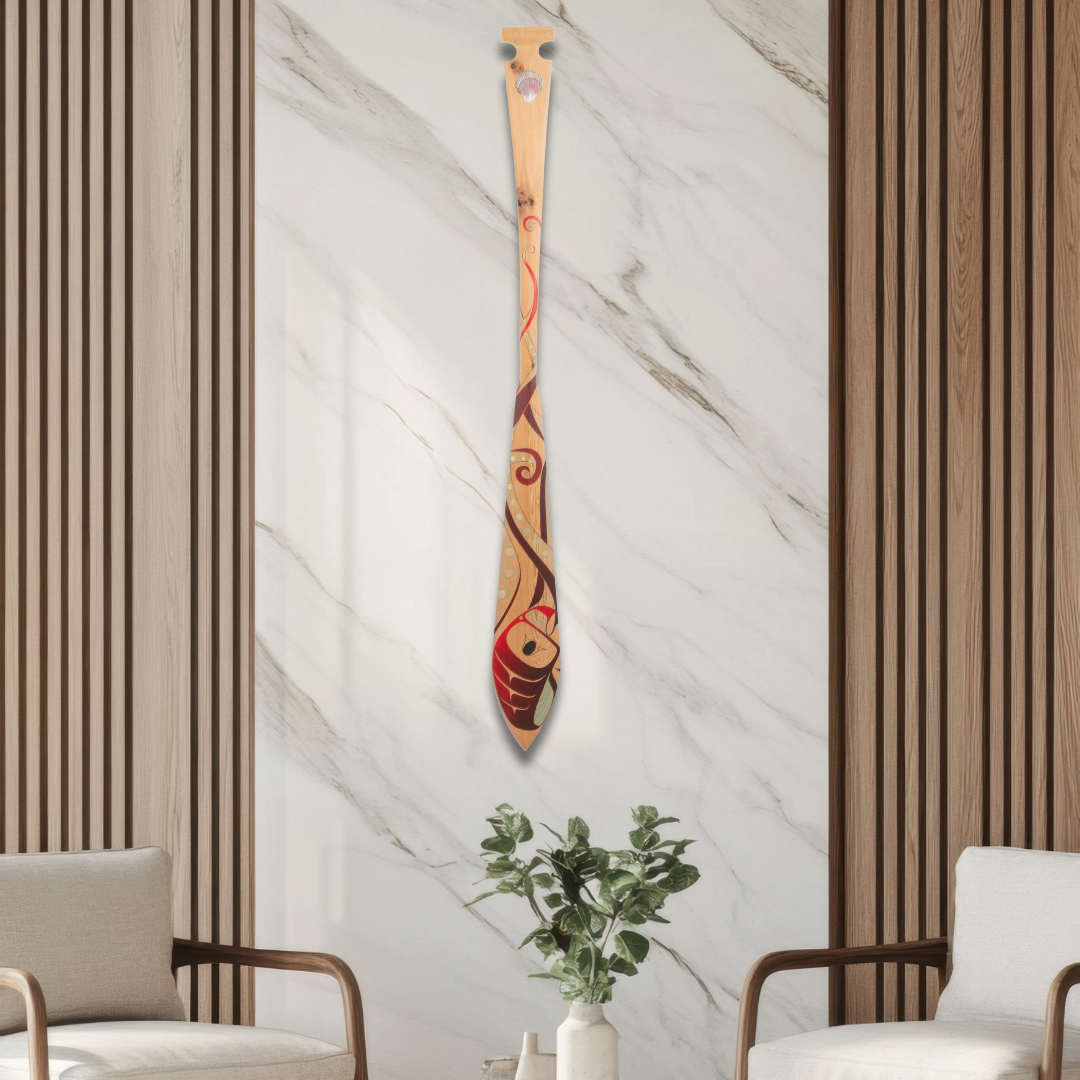 Modern interior with two chairs, a round table, and a decorative paddle on the wall.