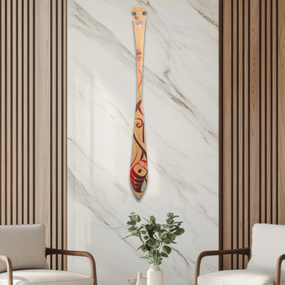 Modern interior with two chairs, a round table, and a decorative paddle on the wall.